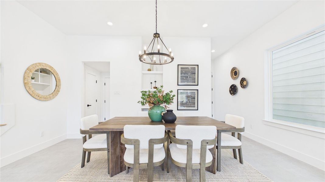 This home offers subtle elegant touches such as the built-in shelving in the dining room, and a mudroom lining the garage entrance.