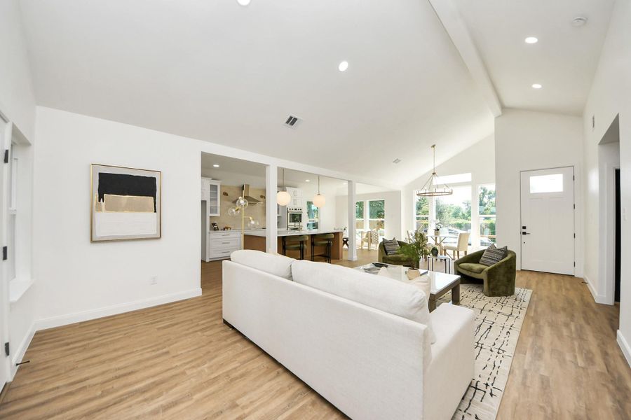 An open, light-filled space where high ceilings and modern lighting create a sense of ease and elegance. Thoughtfully furnished with cozy seating and a dining area that feels both stylish and relaxed—perfect for everyday living or effortless entertaining. An open, light-filled space where high ceilings and modern lighting create a sense of ease and elegance. Thoughtfully furnished with cozy seating and a dining area that feels both stylish and relaxed—perfect for everyday living or effortless entertaining.