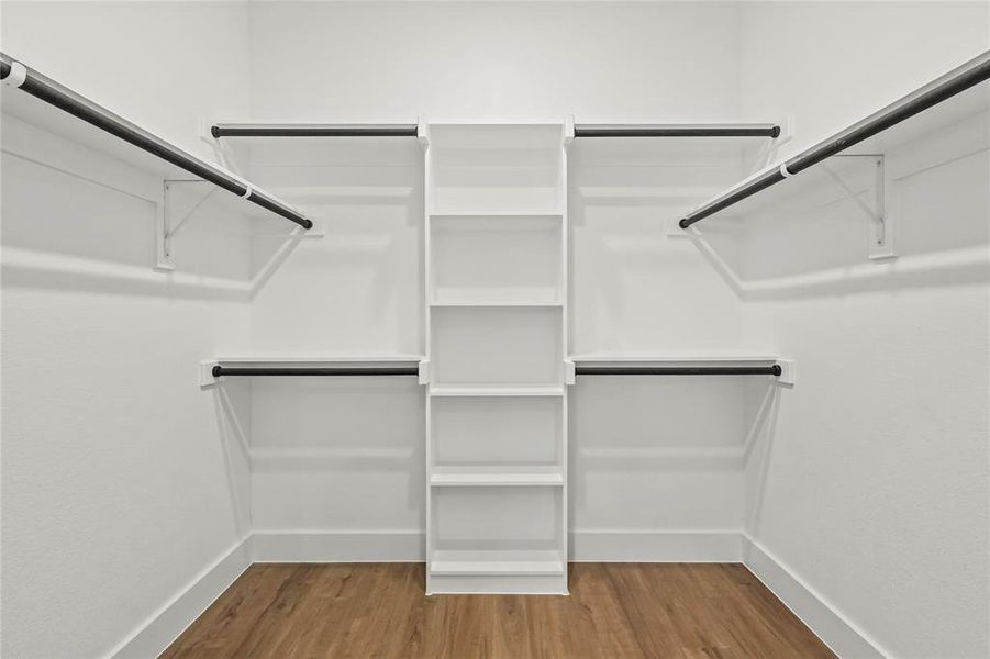 Spacious closet with light wood-style floors
