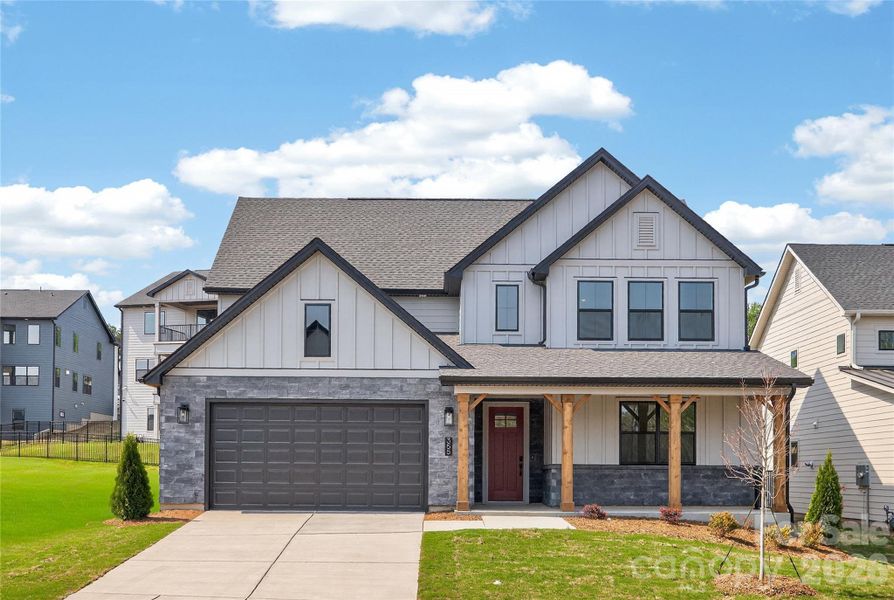 Front exterior of a new home in Windell Woods, Tega Cay, SC, highlighting curb appeal (Image 1). Front exterior of a new home in Windell Woods, Tega Cay, SC, highlighting curb appeal (Image 1).