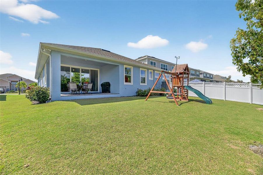Front exterior of a new home in Marisol Pointe at MiraBay Florida Series, Apollo Beach, FL, highlighting curb appeal (Image 25).