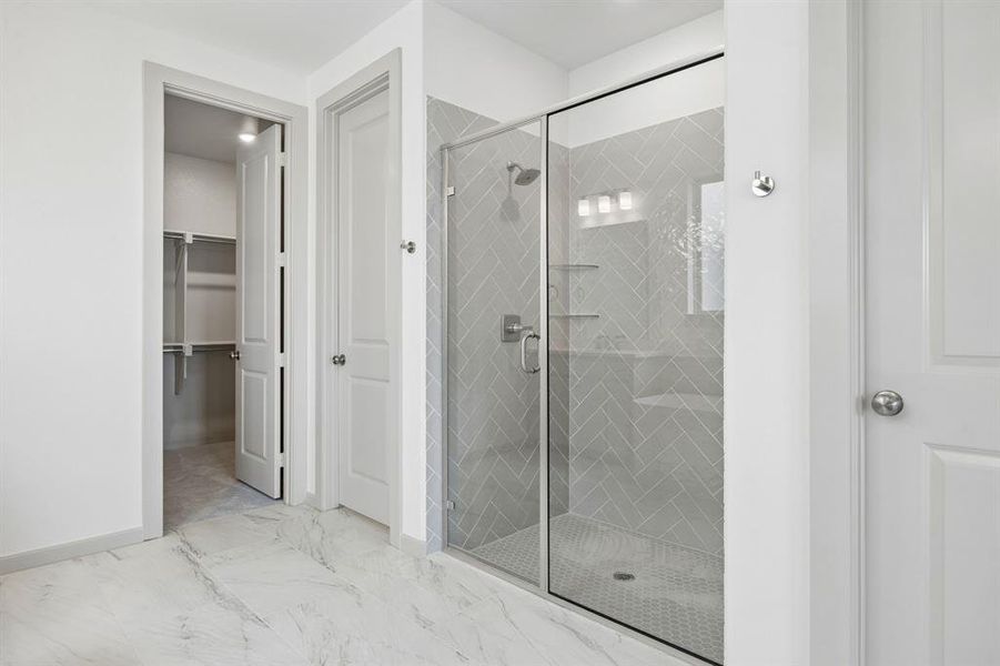 You'll enjoy a spa like experience every day in this spacious owner's bath walk in shower.