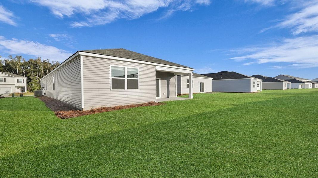 Exterior details and patio area of a home in Pine Hills at Cane Bay, Summerville (Image 23). Exterior details and patio area of a home in Pine Hills at Cane Bay, Summerville (Image 23).