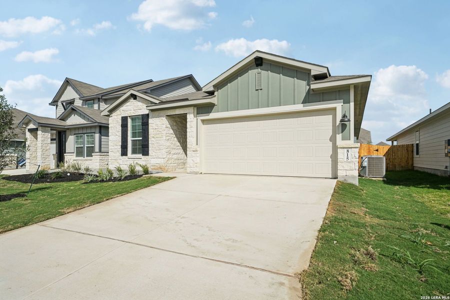 Front exterior of a new home in Estancia Ranch - Premier Series, San Antonio, TX, highlighting curb appeal (Image 20).