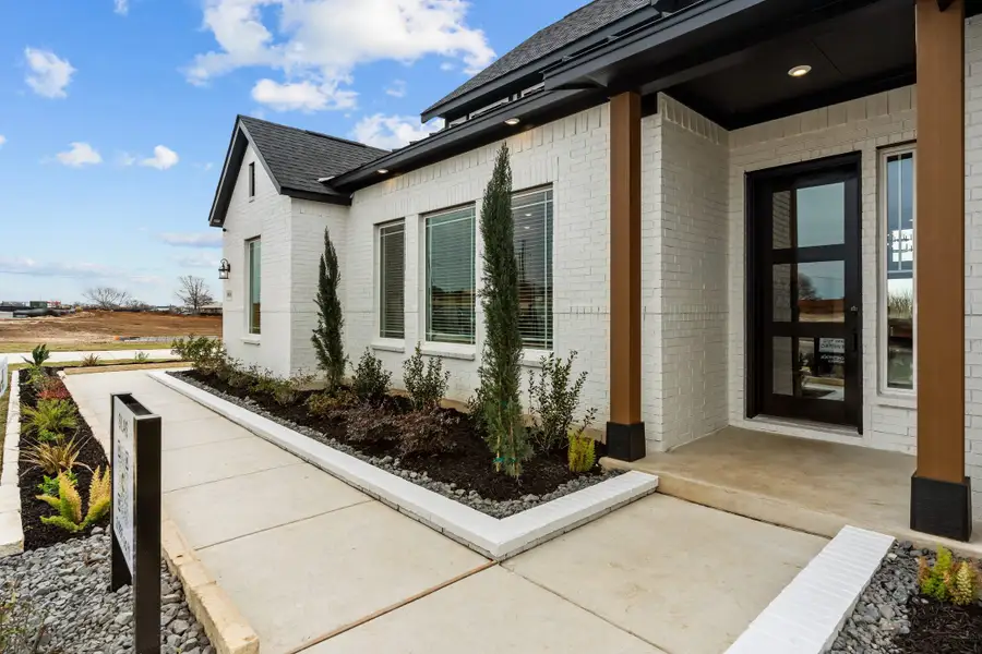 Exterior details and patio area of a home in Lariat, Liberty Hill (Image 32).