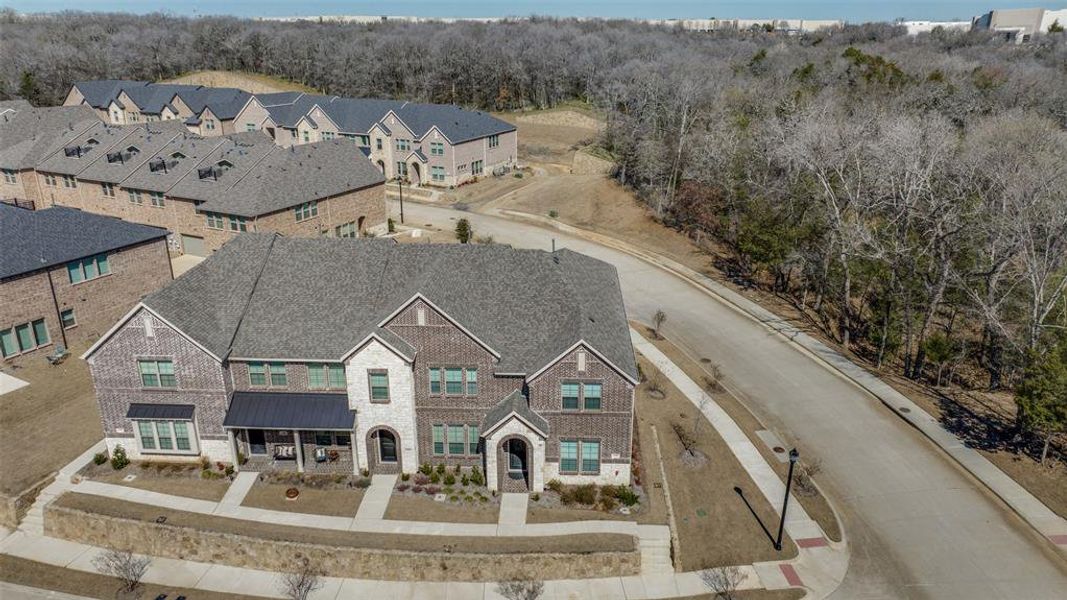 Drone / aerial view featuring a wooded view and a residential view