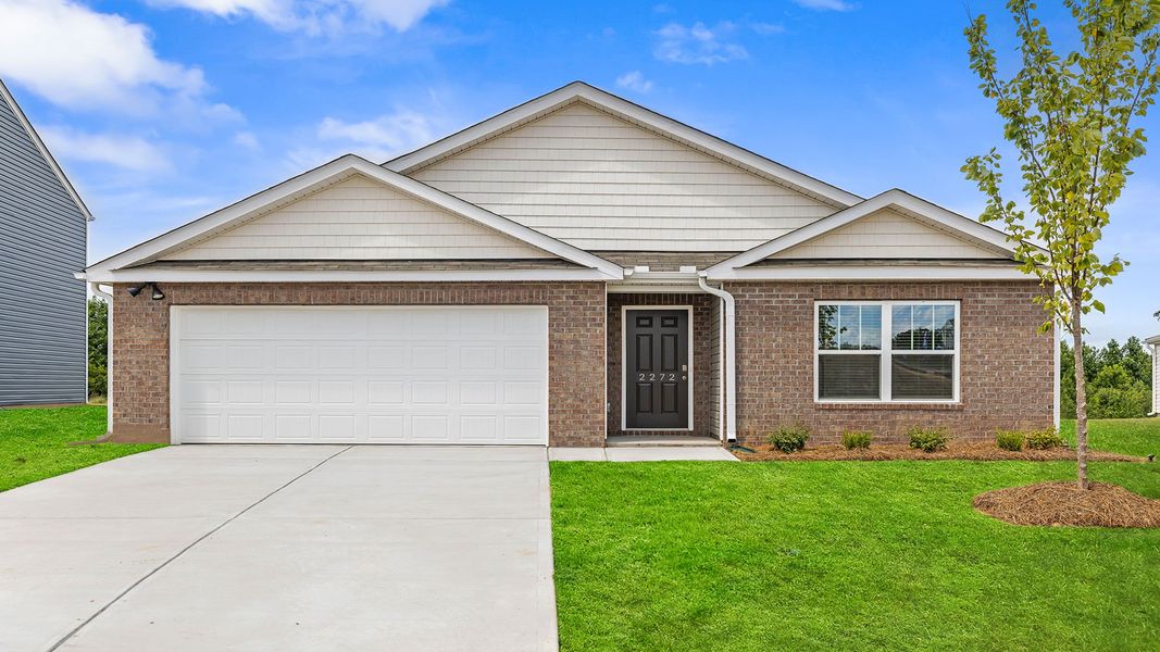 Front exterior of a new home in Treemont Commons, Wellford, SC, highlighting curb appeal (Image 1). Front exterior of a new home in Treemont Commons, Wellford, SC, highlighting curb appeal (Image 1).