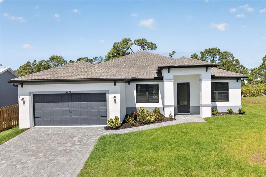 Front exterior of a new home in , Port Charlotte, FL, highlighting curb appeal (Image 23).