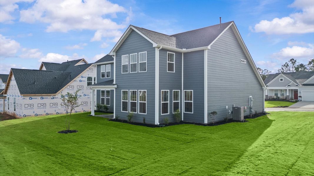 Accomplished exterior with a spacious rear porch that blends comfort and style