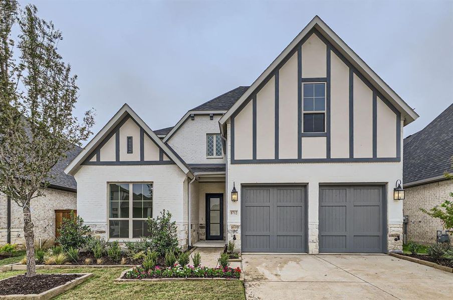 Tudor home featuring a garage