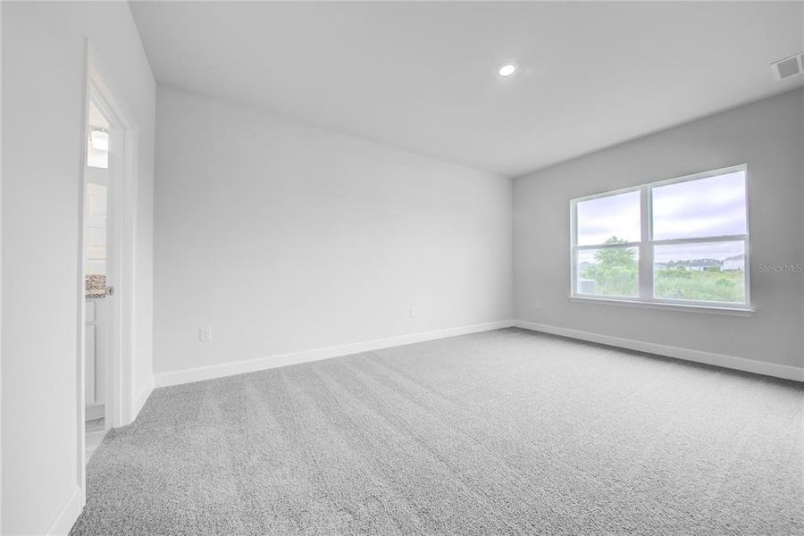Spacious, unfurnished interior of a new home in Aviary at Rutland Ranch, Parrish (Image 19).