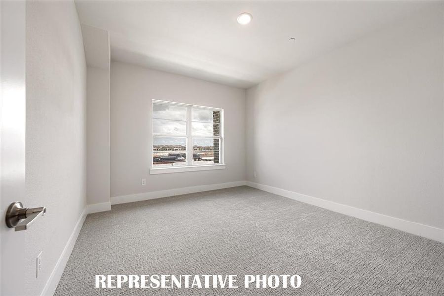 One of 2 nicely sized secondary bedrooms in our Aurora Rev plan. REPRESENTATIVE PHOTO One of 2 nicely sized secondary bedrooms in our Aurora Rev plan. REPRESENTATIVE PHOTO