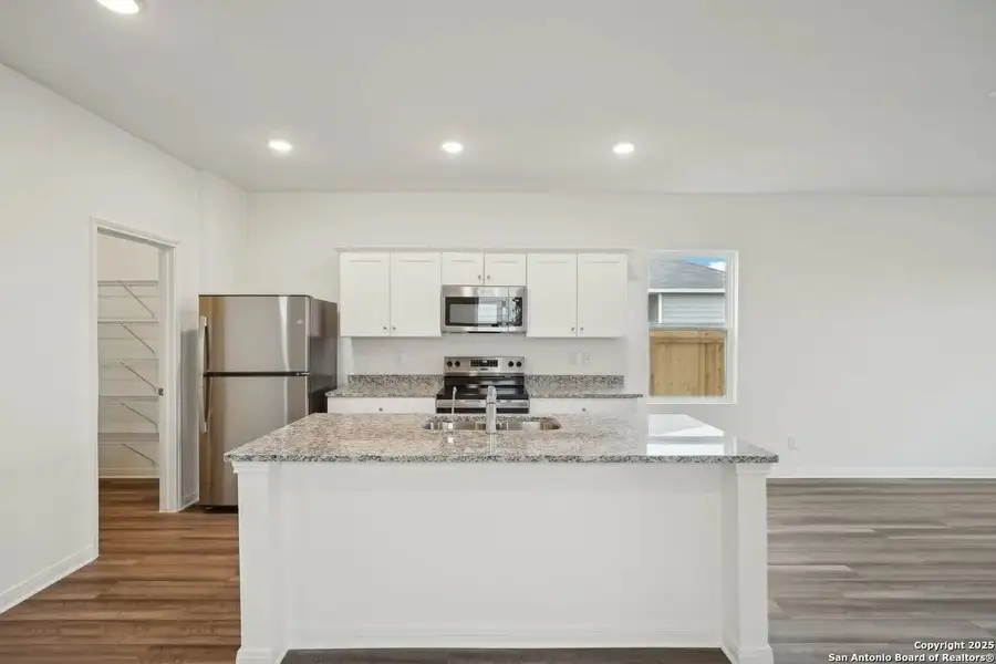 Furnished interior view inside a new home in Sutton Farms, San Antonio (Image 3).