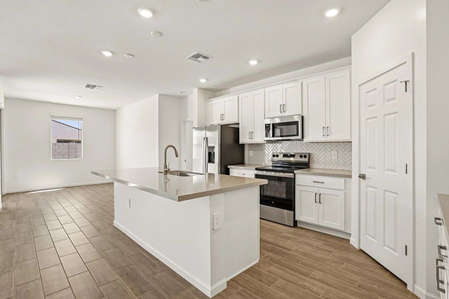 Kitchen and dining. Not actual home, options and finishes may vary.