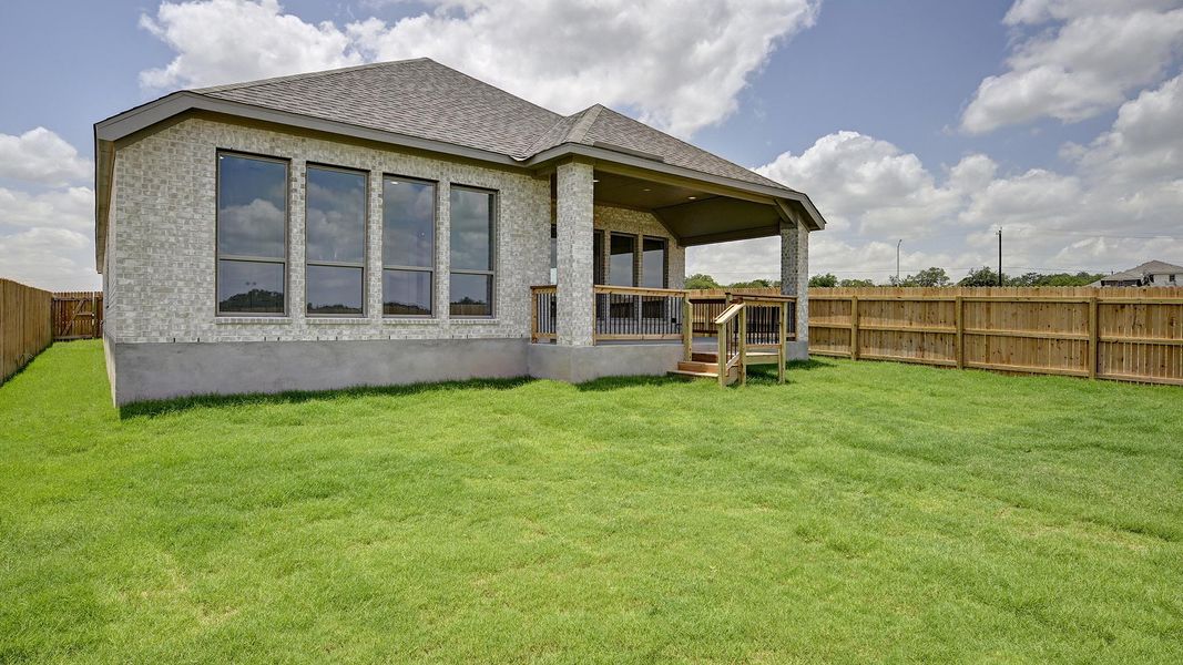 Front exterior of a new home in Alsatian Oaks 50', Castroville, TX, highlighting curb appeal (Image 23). Front exterior of a new home in Alsatian Oaks 50', Castroville, TX, highlighting curb appeal (Image 23).