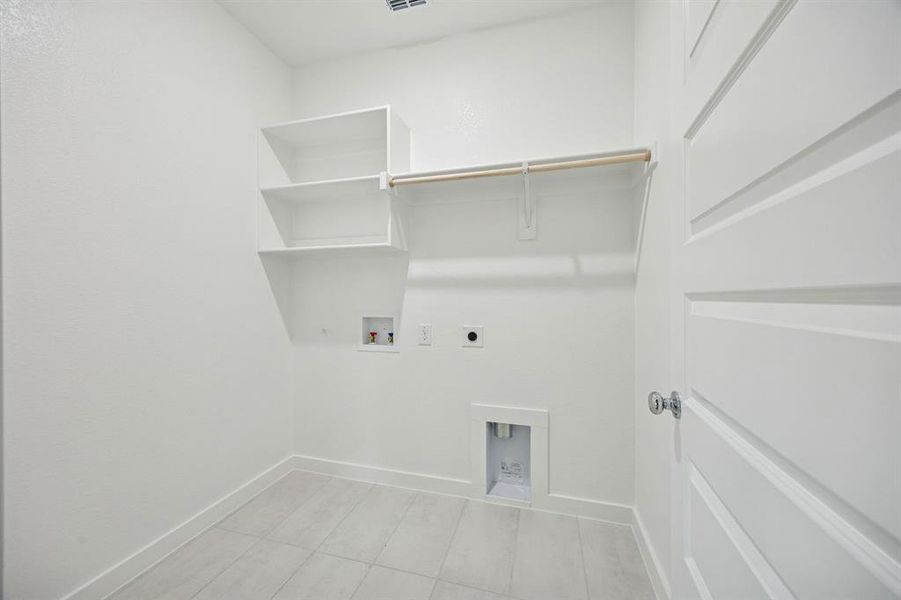 Utility Room in the Stanley II home plan by Trophy Signature Homes – REPRESENTATIVE PHOTO