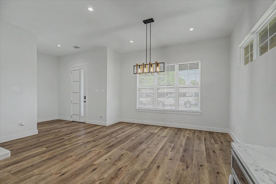 Dining and entry area featuring an open-concept layout, and natural light.
