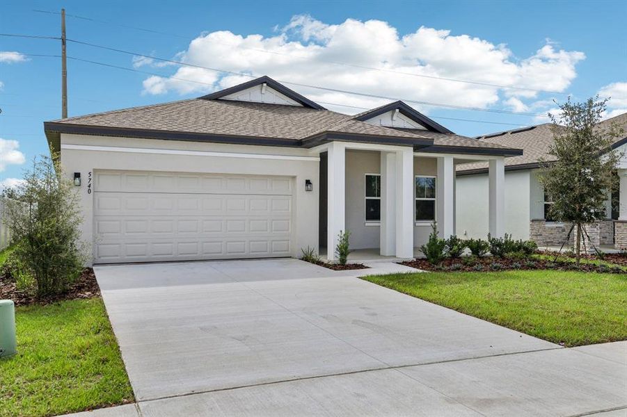 Front exterior of a new home in Sunbrooke, St. Cloud, FL, highlighting curb appeal (Image 1). Front exterior of a new home in Sunbrooke, St. Cloud, FL, highlighting curb appeal (Image 1).