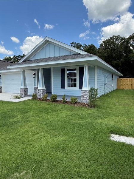 Front exterior of a new home in Savannah Station, Alachua, FL, highlighting curb appeal (Image 25).