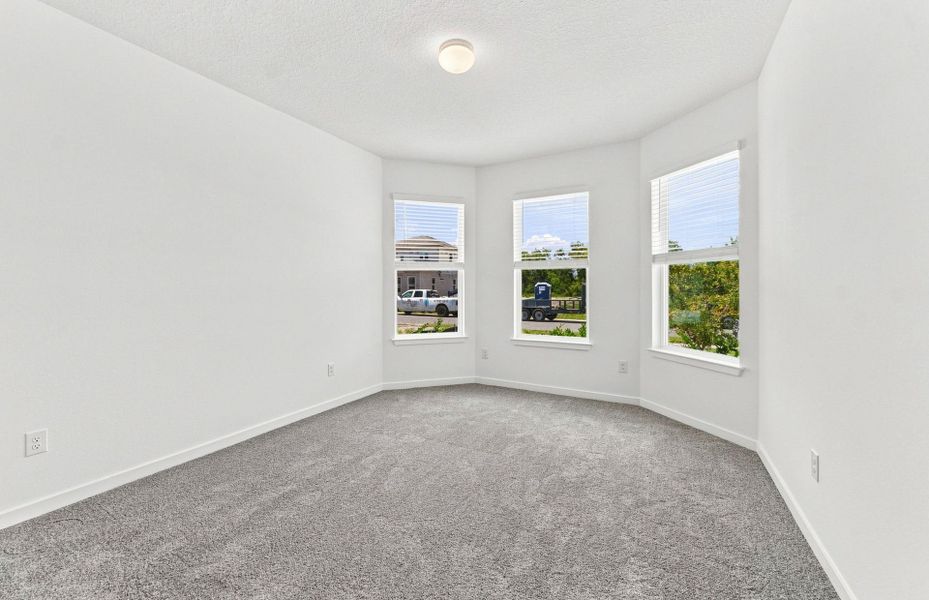 Spacious, unfurnished interior of a new home in Vida's Way, Wesley Chapel (Image 12).