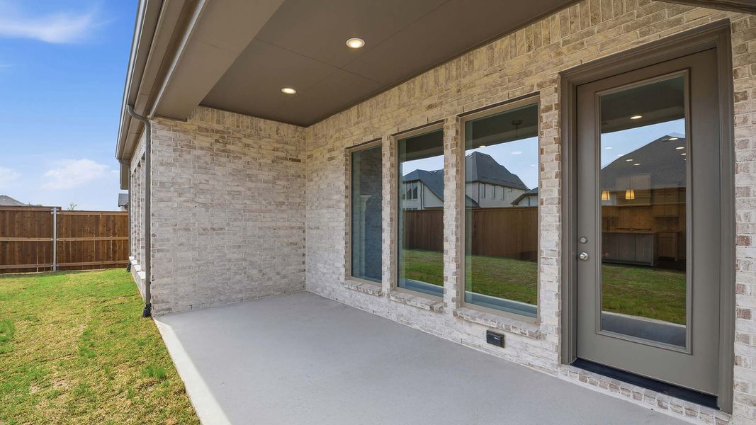 Exterior details and patio area of a home in Cambridge Crossing, Celina (Image 4).