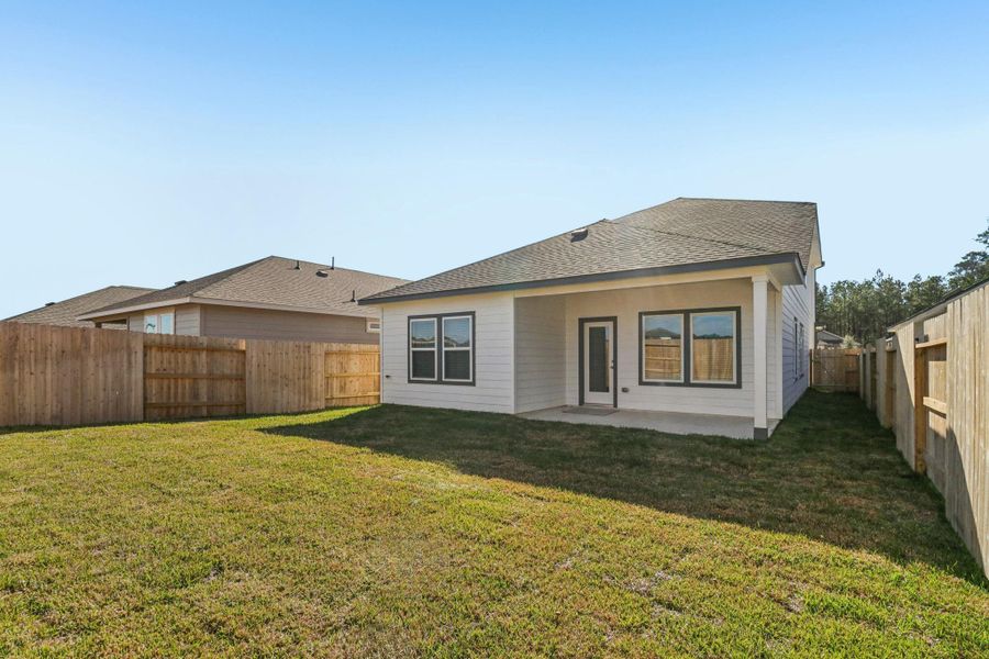 Exterior details and patio area of a home in Landing Meadows - Traditional Series, New Caney (Image 3).