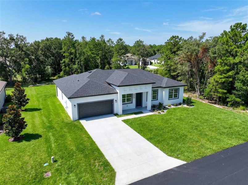 Front exterior of a new home in , Ocala, FL, highlighting curb appeal (Image 22). Front exterior of a new home in , Ocala, FL, highlighting curb appeal (Image 22).