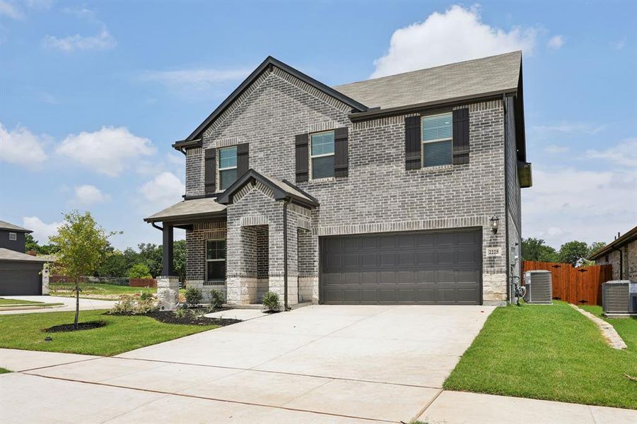 Front exterior of a new home in Westmoor, Sherman, TX, highlighting curb appeal (Image 23).