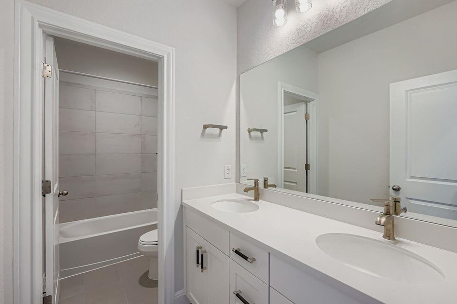 Furnished interior view inside a new home in 6 Creeks, Kyle (Image 3).