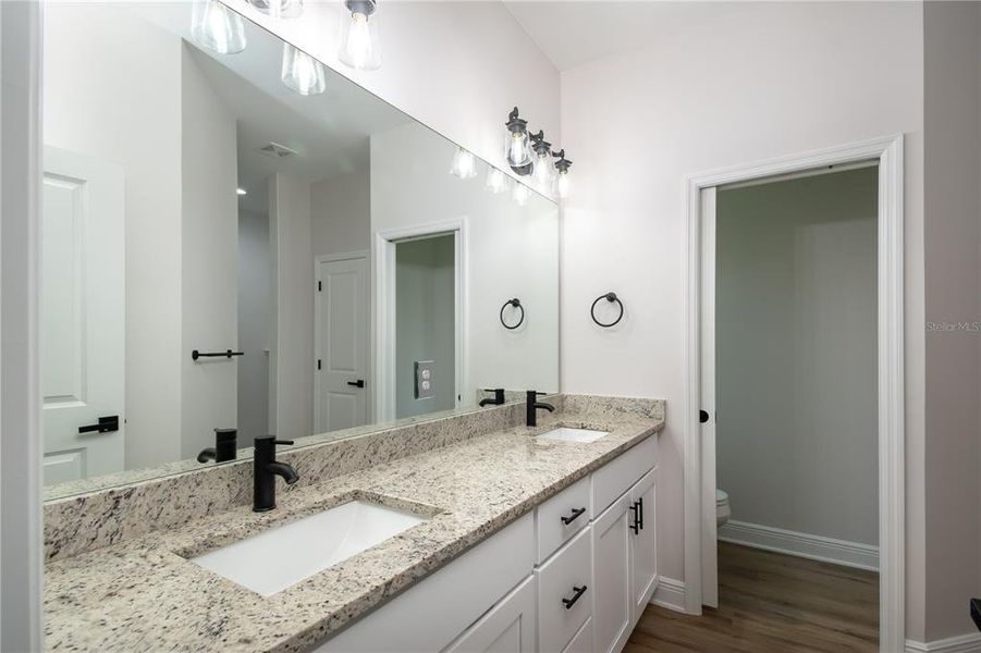 Sample - Primary Owners Bathroom with Granite Countertops and Private Water Closet