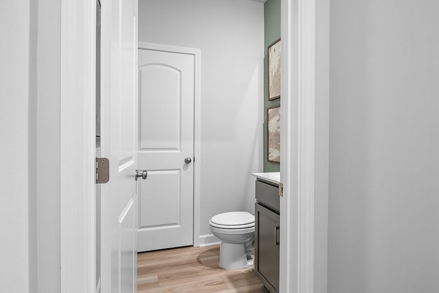 A bathroom with white doors. A bathroom with white doors.