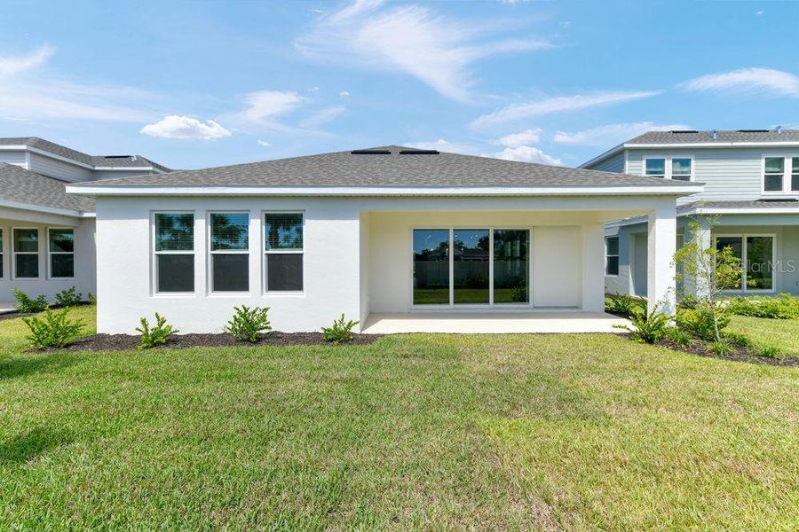 Exterior details and patio area of a home in Tiburon, Nokomis (Image 3).