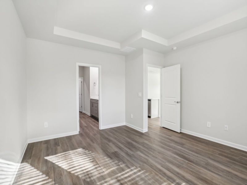 Primary bedroom in the Chandler floorplan at a Meritage Homes community in Angier, NC.