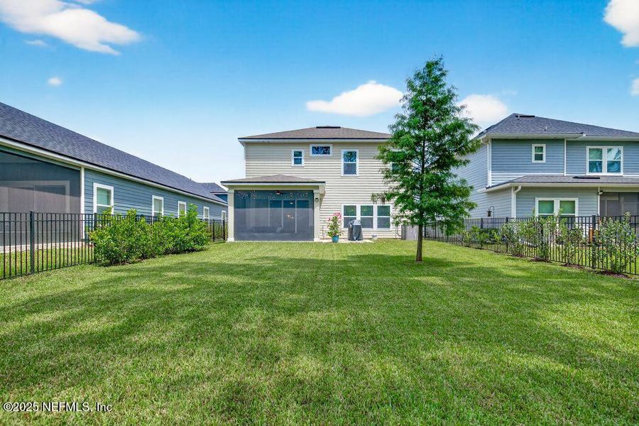 Front exterior of a new home in Tributary, Yulee, FL, highlighting curb appeal (Image 26).