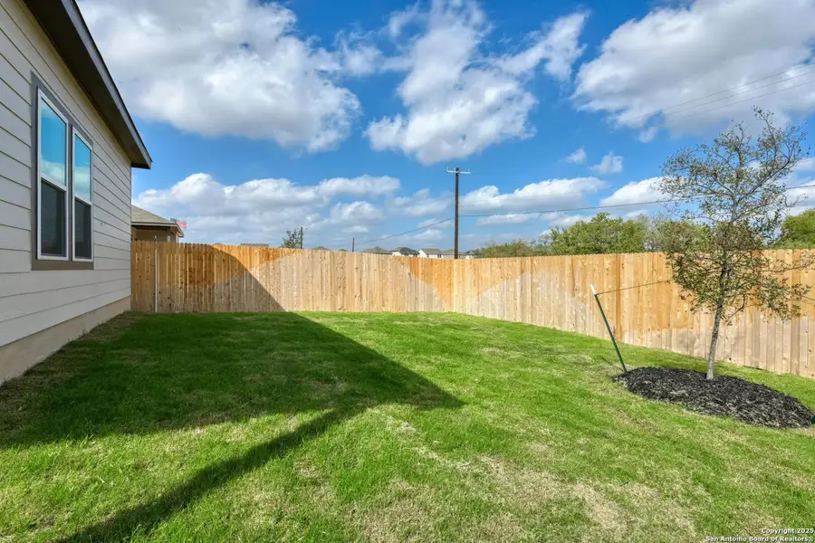 Exterior details and patio area of a home in Meadows at Hennersby Hollow 40's, San Antonio (Image 3).