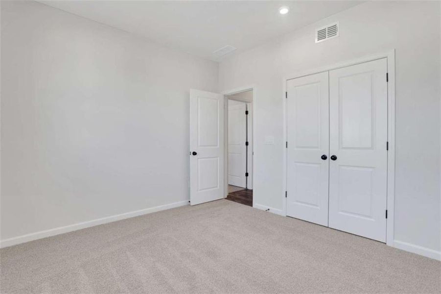 Spacious, unfurnished interior of a new home in The Paddocks at Doc Hughes, Buford (Image 45).