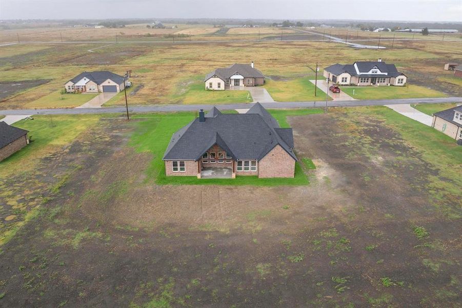 Birds eye view of property featuring a rural view