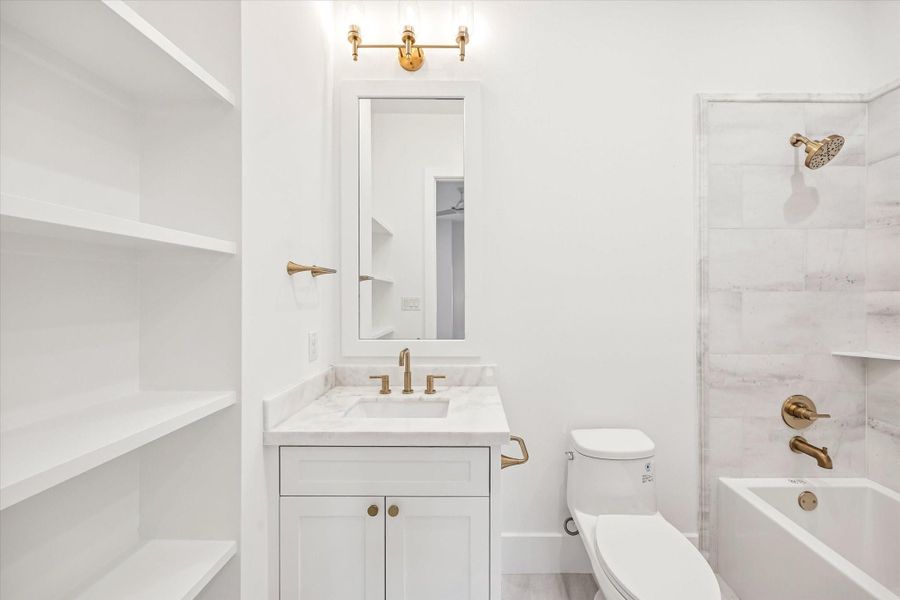 Built in shelving and a streamlined vanity maximize storage while keeping the space feeling light and open. Classic tile, stone surfaces, and warm metal fixtures deliver a clean, durable bath designed for everyday use.**Previous build by Arch Angelo** Built in shelving and a streamlined vanity maximize storage while keeping the space feeling light and open. Classic tile, stone surfaces, and warm metal fixtures deliver a clean, durable bath designed for everyday use.**Previous build by Arch Angelo**