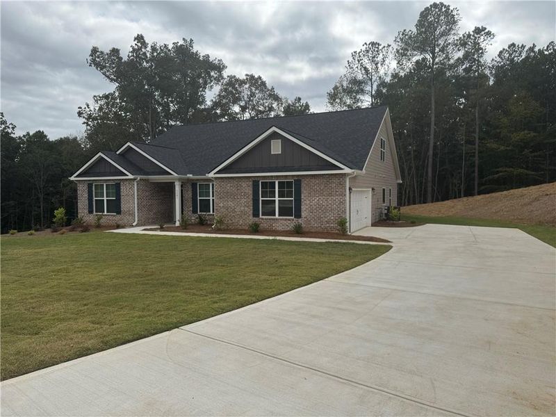 Front exterior of a new home in Tuscany Hills, Douglasville, GA, highlighting curb appeal (Image 14).