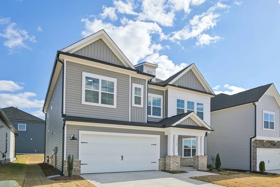 Exterior  - Earthy textures and warm tones feel rooted in place.