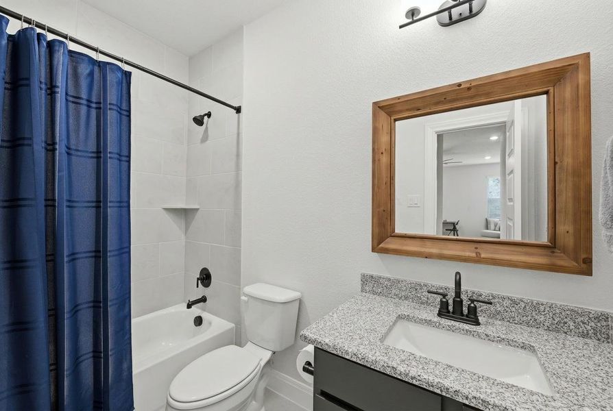 A well-appointed bathroom with a spacious vanity, sleek fixtures, and a clean, contemporary aesthetic. A well-appointed bathroom with a spacious vanity, sleek fixtures, and a clean, contemporary aesthetic.