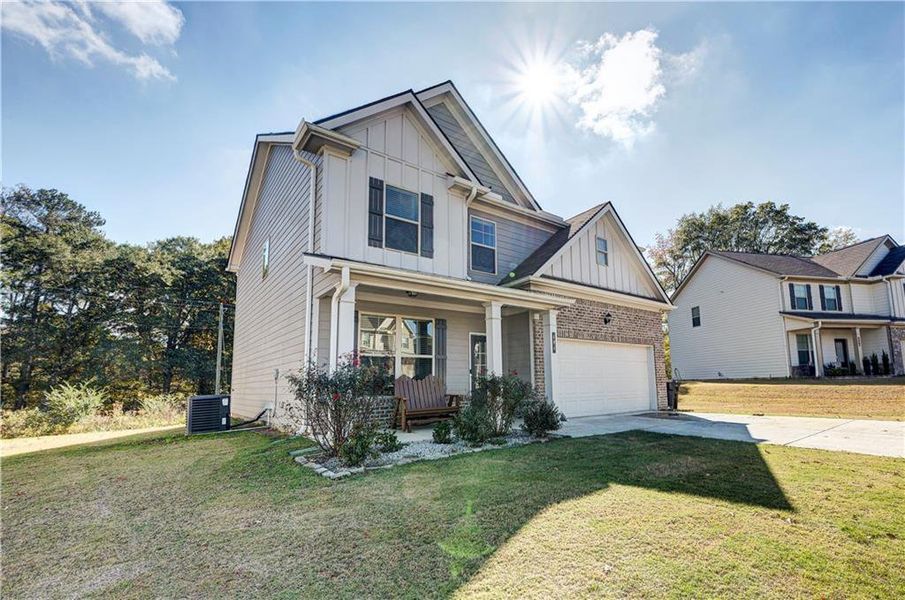 Front exterior of a new home in , Calhoun, GA, highlighting curb appeal (Image 1).