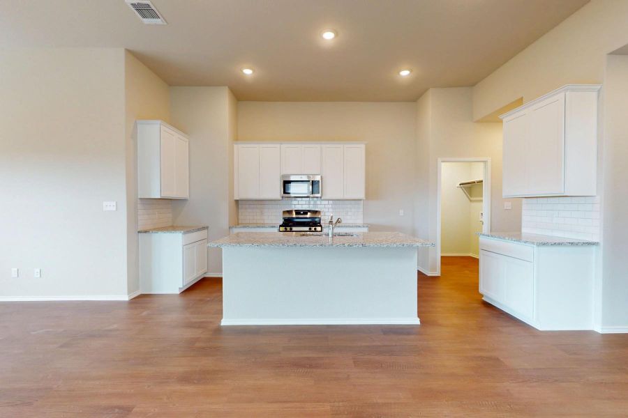 Furnished interior view inside a new home in Carillon, Manor (Image 9).