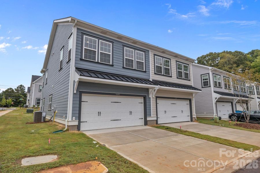Front exterior of a new home in Sycamore Trail, Matthews, NC, highlighting curb appeal (Image 23).