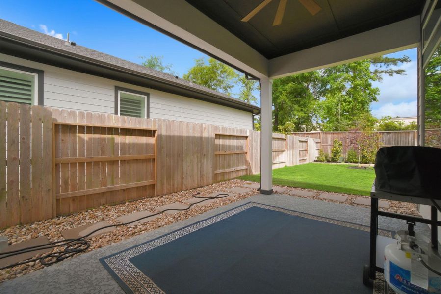 Exterior details and patio area of a home in Woodforest - Kingsley Square 50' Homesites, Montgomery (Image 19).