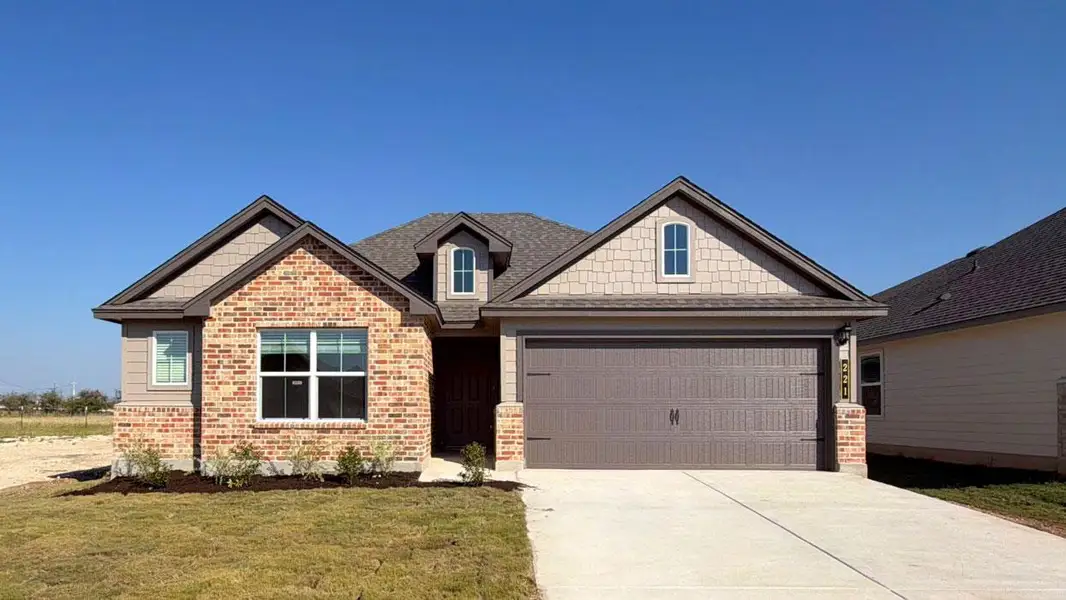 Front exterior of a new home in Eastern Wells, Jarrell, TX, highlighting curb appeal (Image 1). Front exterior of a new home in Eastern Wells, Jarrell, TX, highlighting curb appeal (Image 1).