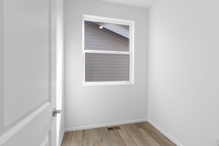 Spacious, unfurnished interior of a new home in The Cottages Collection at Ridgeline Vista, Brighton (Image 19).