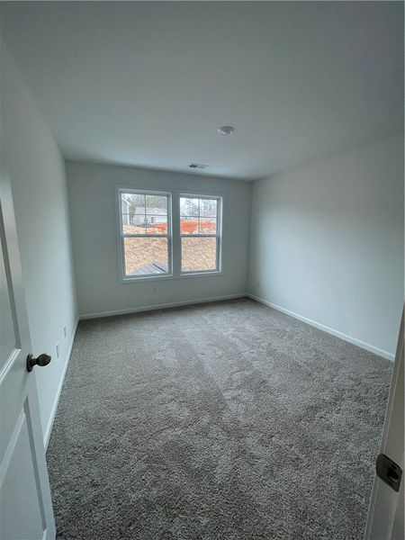 Spacious, unfurnished interior of a new home in Springwood Grove, Central (Image 24).