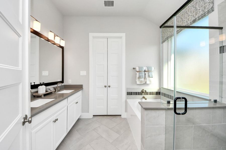 Furnished interior view inside a new home in Sunterra: Premier Collection, Katy (Image 10).