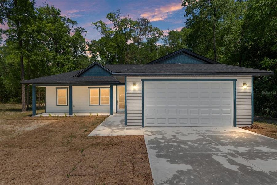 Front exterior of a new home in , Fort White, FL, highlighting curb appeal (Image 27).